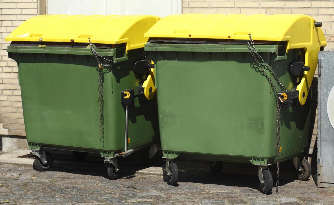 two locked green dumpster